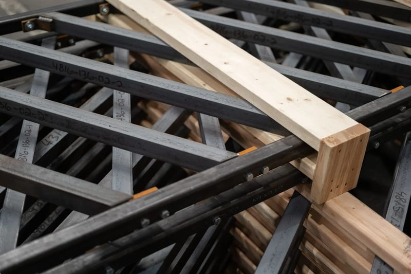 Stacked fabricated steel frames with diagonal cross members