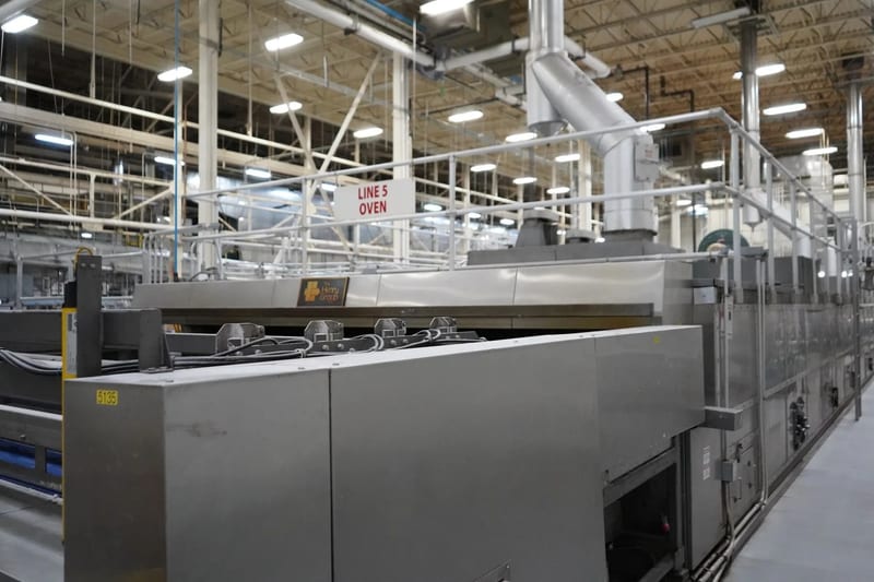 Installed bakery oven and conveyor line inside a production facility