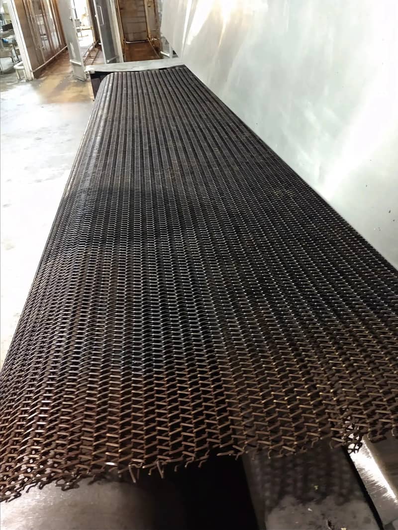 Worn conveyor belt photographed before rebuild work