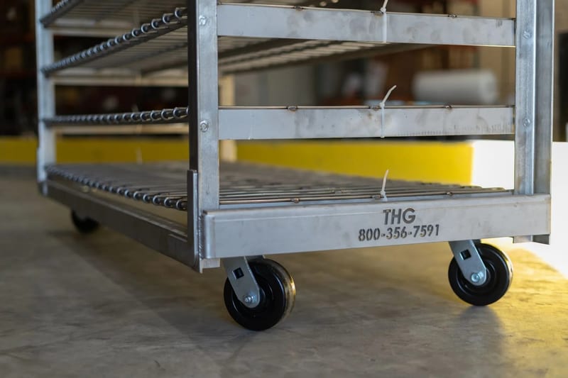 Lower shelves and wheels of a fabricated stainless-steel bread rack