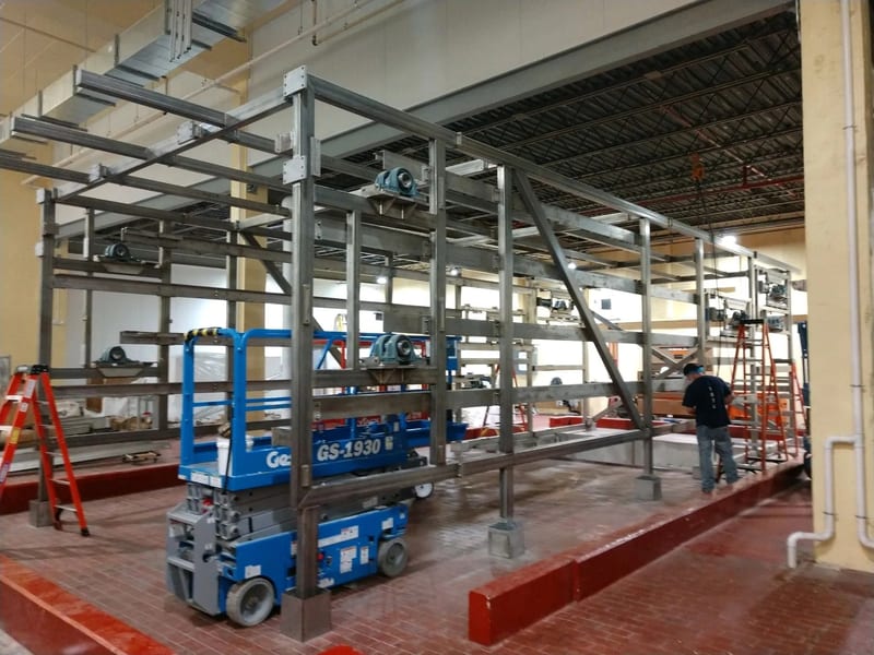 Open steel frame and tray supports during proofer assembly