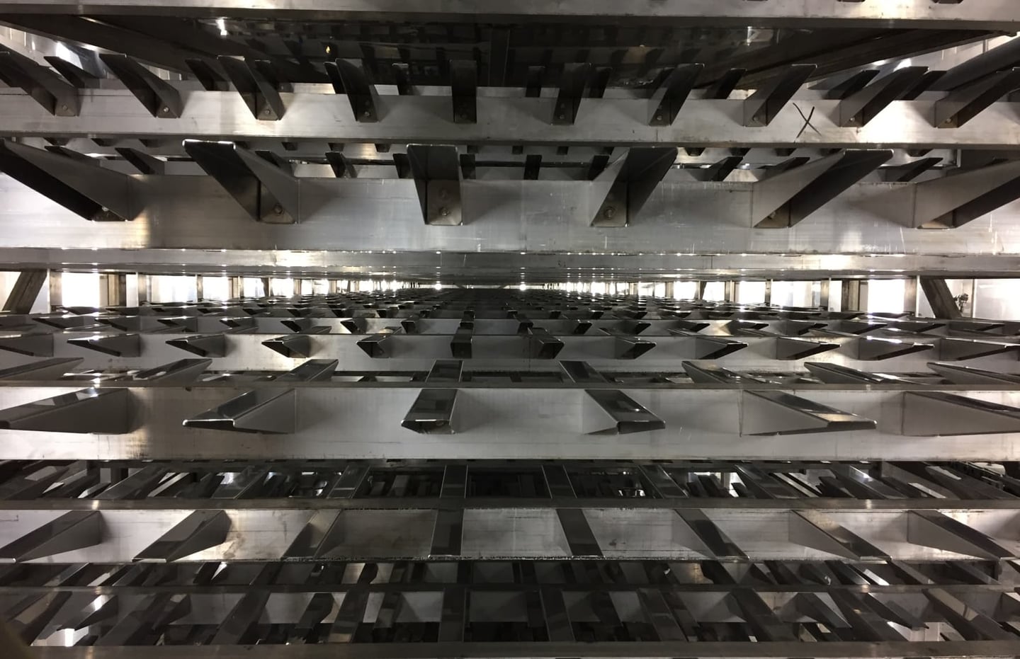 Carrier circuit beneath bakery equipment