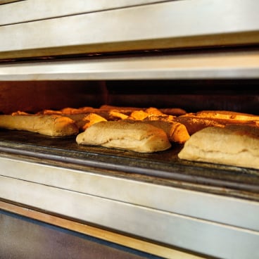 Bread inside a tunnel oven